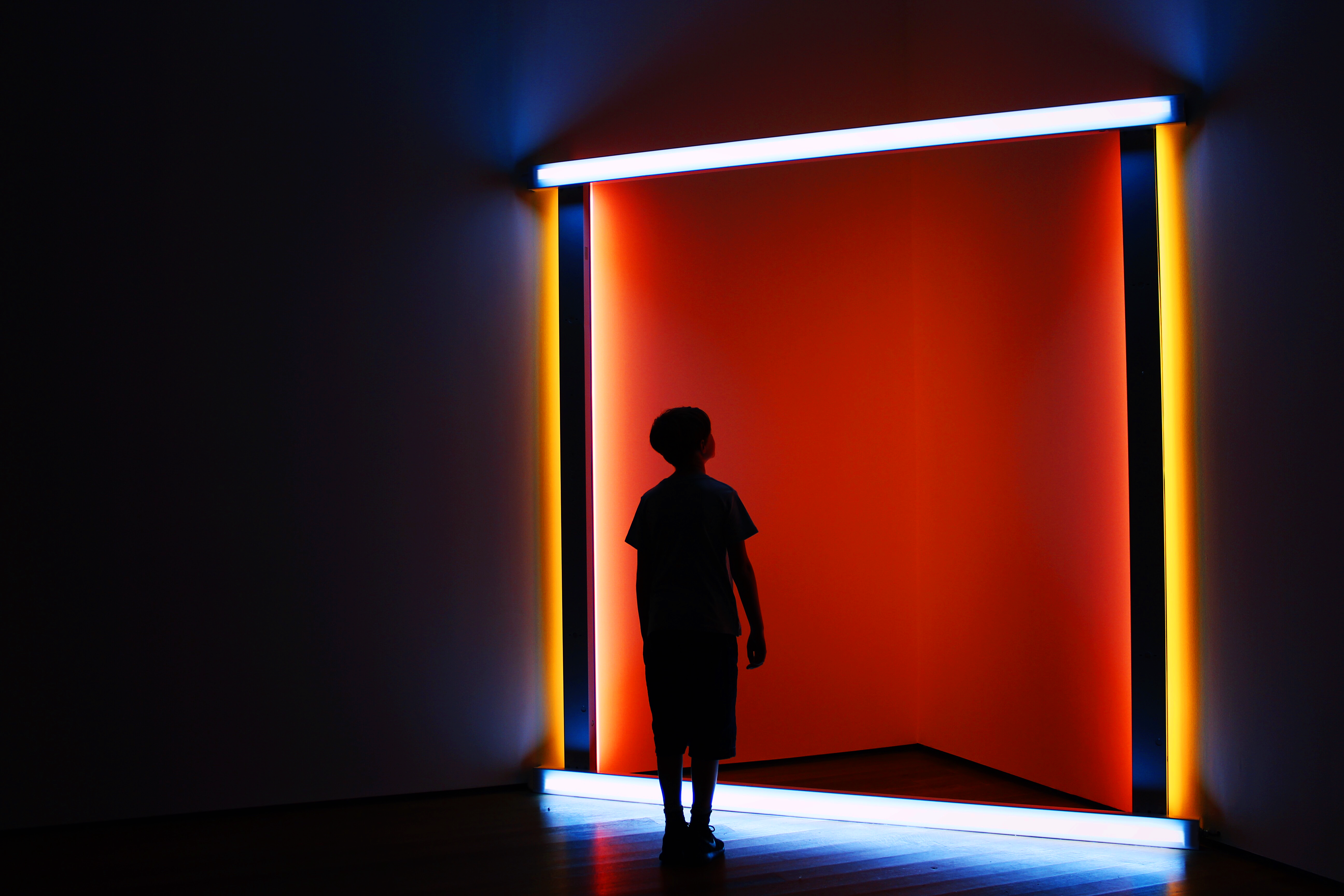 boy-looking-up-into-coloured-lights_t20_vRYaxl